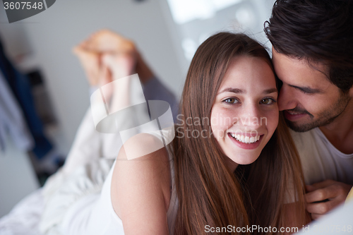 Image of couple relax and have fun in bed