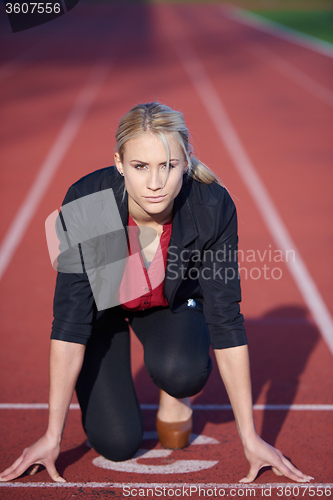 Image of business woman ready to sprint