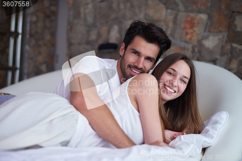 Image of couple relax and have fun in bed