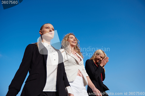 Image of business people running on racing track