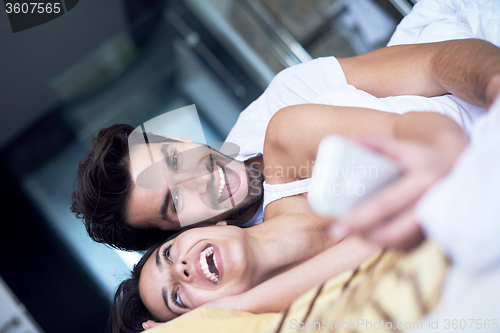 Image of couple relax and have fun in bed