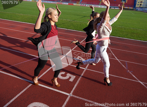 Image of business people running on racing track