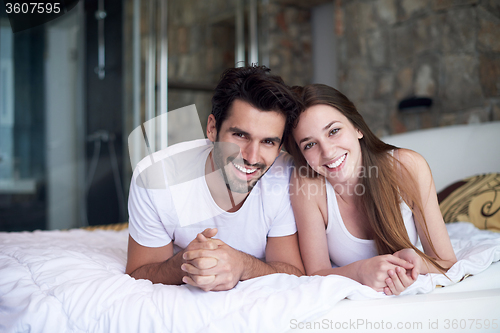 Image of couple relax and have fun in bed