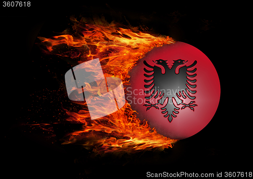 Image of Flag with a trail of fire - Albania