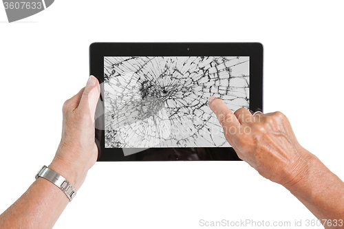 Image of Senior lady with tablet, cracked screen