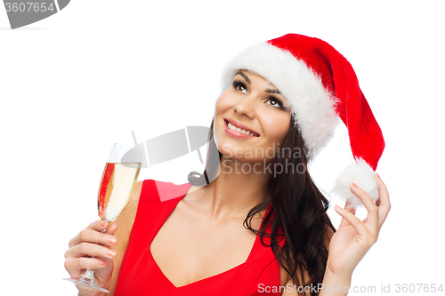 Image of beautiful sexy woman in santa hat and red dress