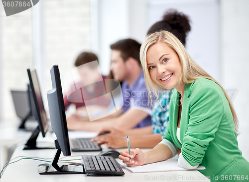 Image of happy high school students in computer class