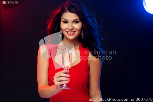 Image of beautiful woman with champagne glass at nightclub