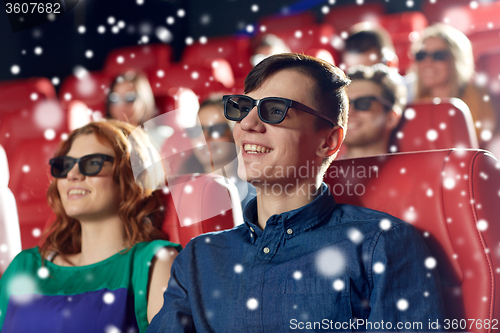 Image of happy friends watching movie in 3d theater