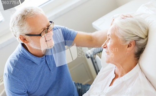 Image of senior couple meeting at hospital ward