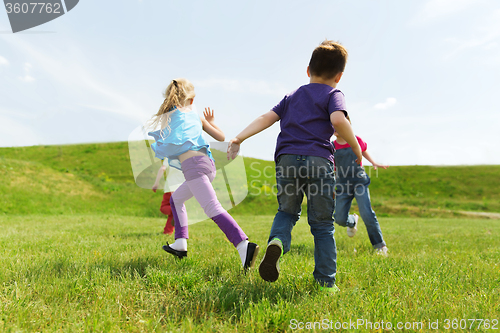 Image of group of happy kids running outdoors