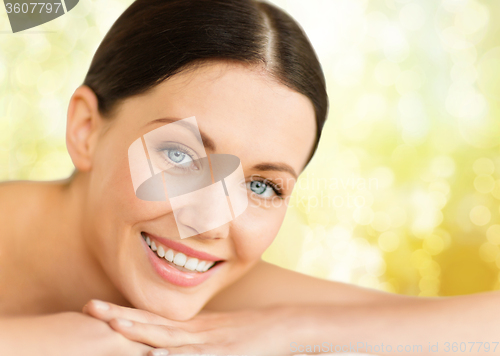 Image of beautiful smiling woman in spa salon