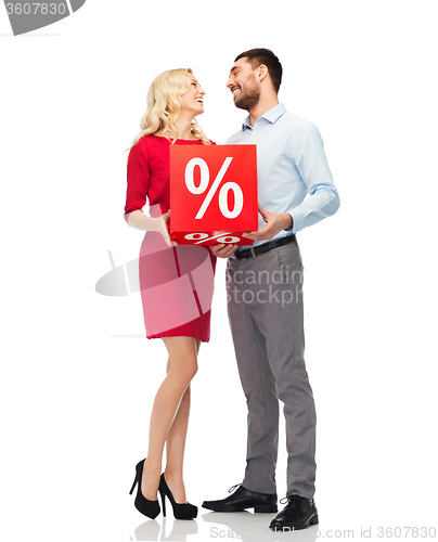 Image of happy couple with red sale sign