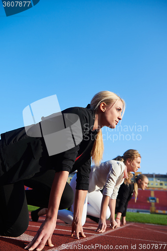 Image of business woman ready to sprint