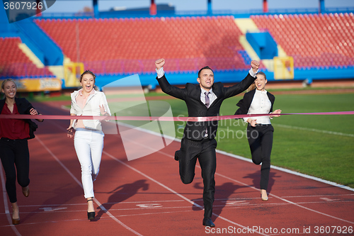 Image of business people running on racing track