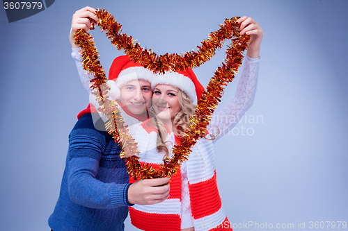 Image of Lovely couple with christmas  garland