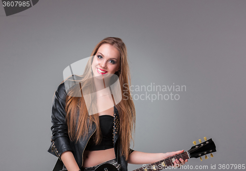 Image of Beautiful girl playing guitar