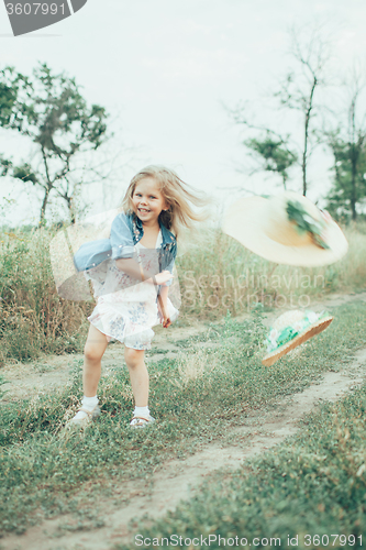 Image of The young girl on green grass background 