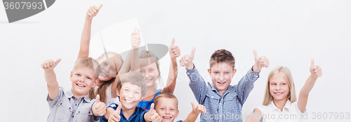 Image of Portrait of happy children showing thumbs up gesture