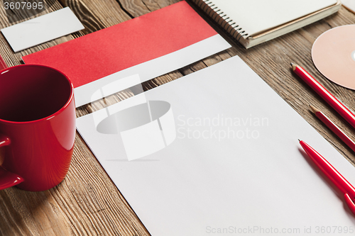 Image of The mockup on wooden background with red calculator
