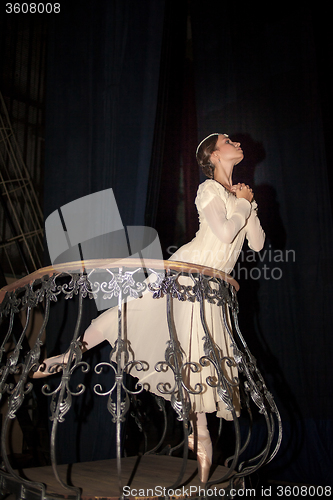 Image of The beautiful ballerina posing in long white dress