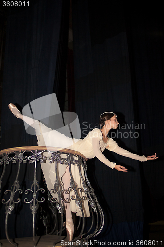 Image of The beautiful ballerina posing in long white dress