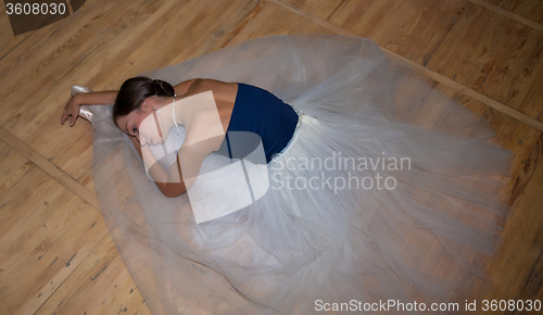 Image of The beautiful ballerina posing in long white skirt 