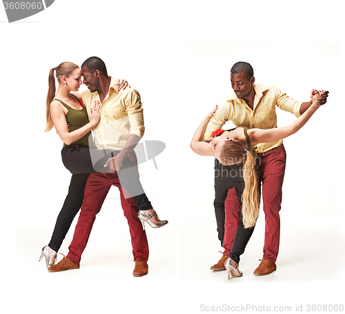 Image of Young couple dances Caribbean Salsa, studio shot