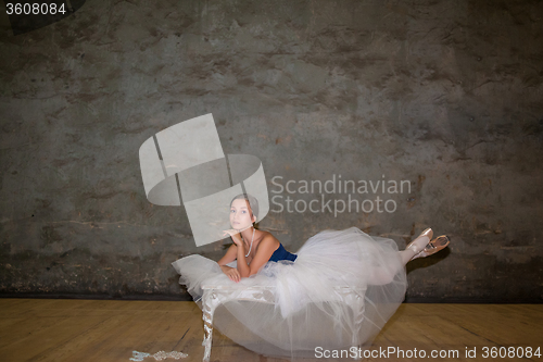 Image of The beautiful ballerina posing in long white skirt 