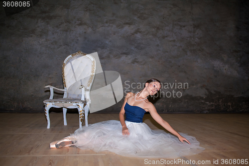 Image of The beautiful ballerina posing in long white skirt 