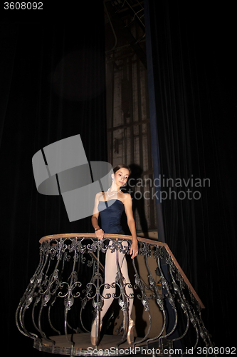 Image of The beautiful ballerina posing in long white dress