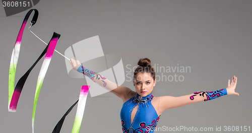 Image of teenager doing gymnastics dance with ribbon