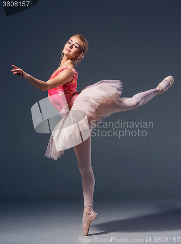 Image of Beautiful female ballet dancer on a gray background