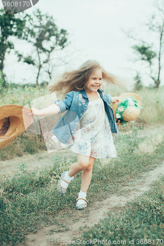 Image of The young girl on green grass background 