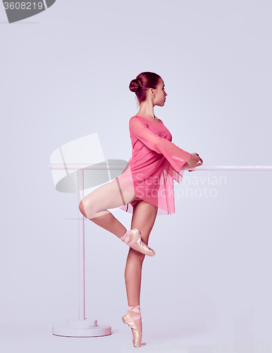 Image of Ballerina stretching on the bar