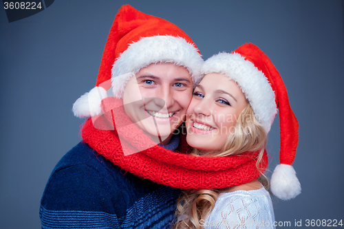 Image of Lovely christmas couple in Santa Claus hats