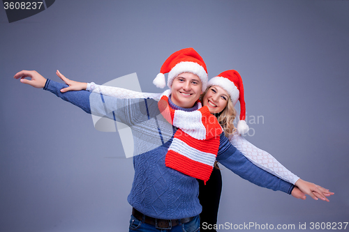 Image of Lovely christmas couple in Santa Claus hats