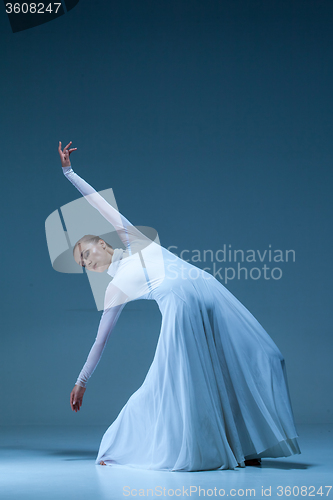 Image of Portrait of the ballerina on blue background