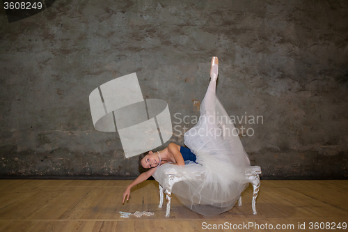 Image of The beautiful ballerina posing in long white skirt 