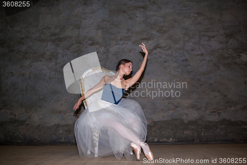 Image of The beautiful ballerina posing in long white skirt 