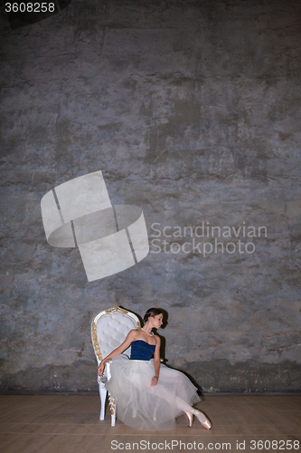 Image of The beautiful ballerina posing in long white skirt 