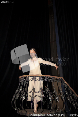 Image of The beautiful ballerina posing in long white dress