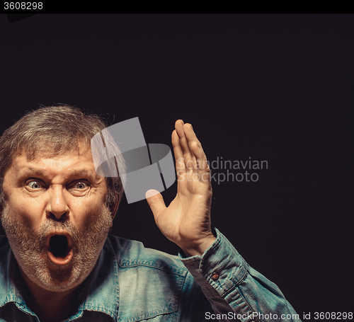 Image of The screaming man in denim shirt 