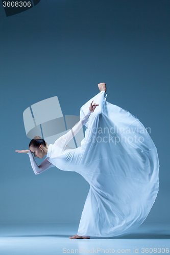 Image of Portrait of the ballerina on blue background