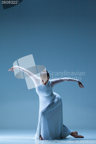 Image of Portrait of the ballerina on blue background