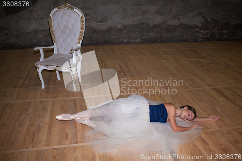 Image of The beautiful ballerina posing in long white skirt 