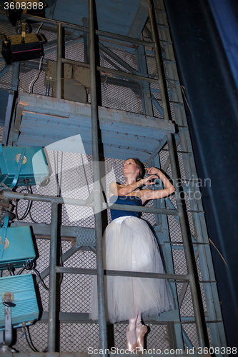 Image of The beautiful ballerina posing in long white skirt 