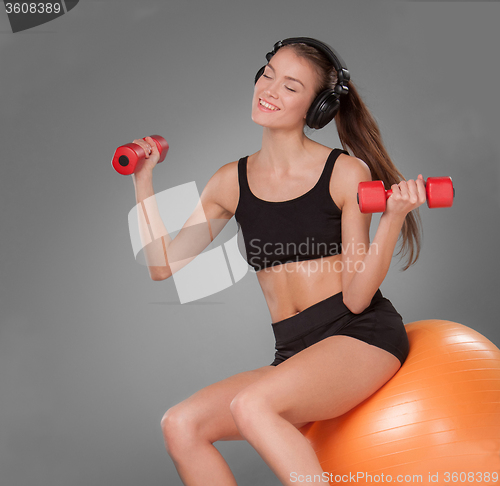 Image of Sporty woman doing aerobic exercise 