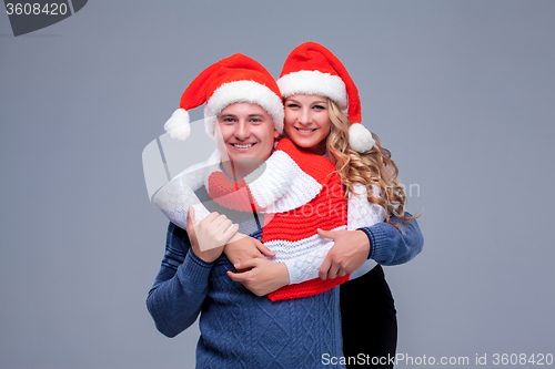 Image of Lovely christmas couple in Santa Claus hats