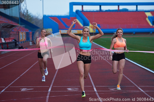 Image of Female Runners Finishing Race Together